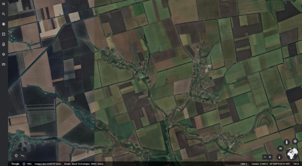 coloured satellite image of fields in Ukraine as seen in Google Earth. patchwork of rectangles of various sizes and varying shade of brown and green. 