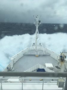 Ship bow moving into heavy seas