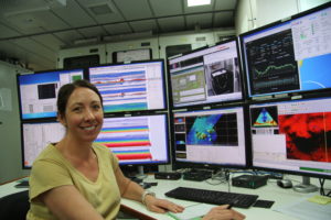 Photo of scientist Dr Vanessa Lucieer working on some multibeam swath data.