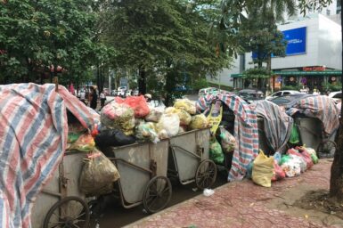 piles of rubbish in large bins