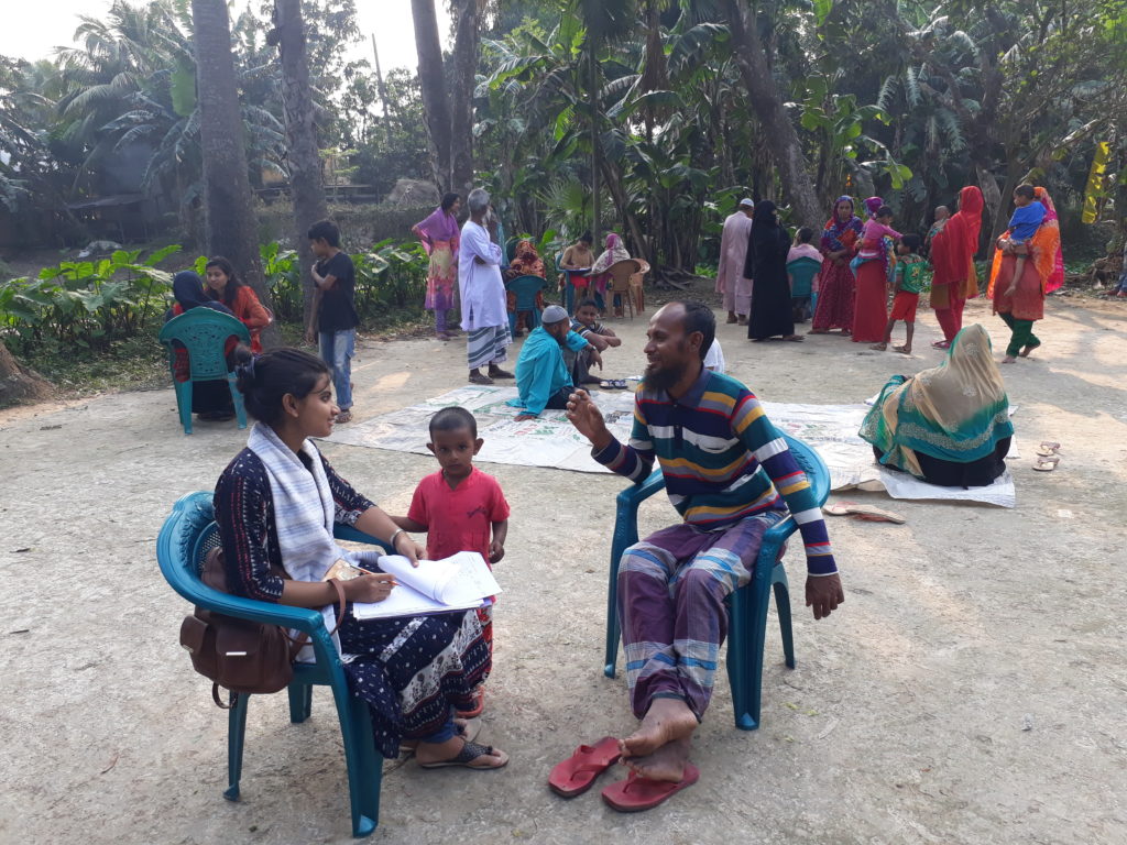 Data collector interviewing community