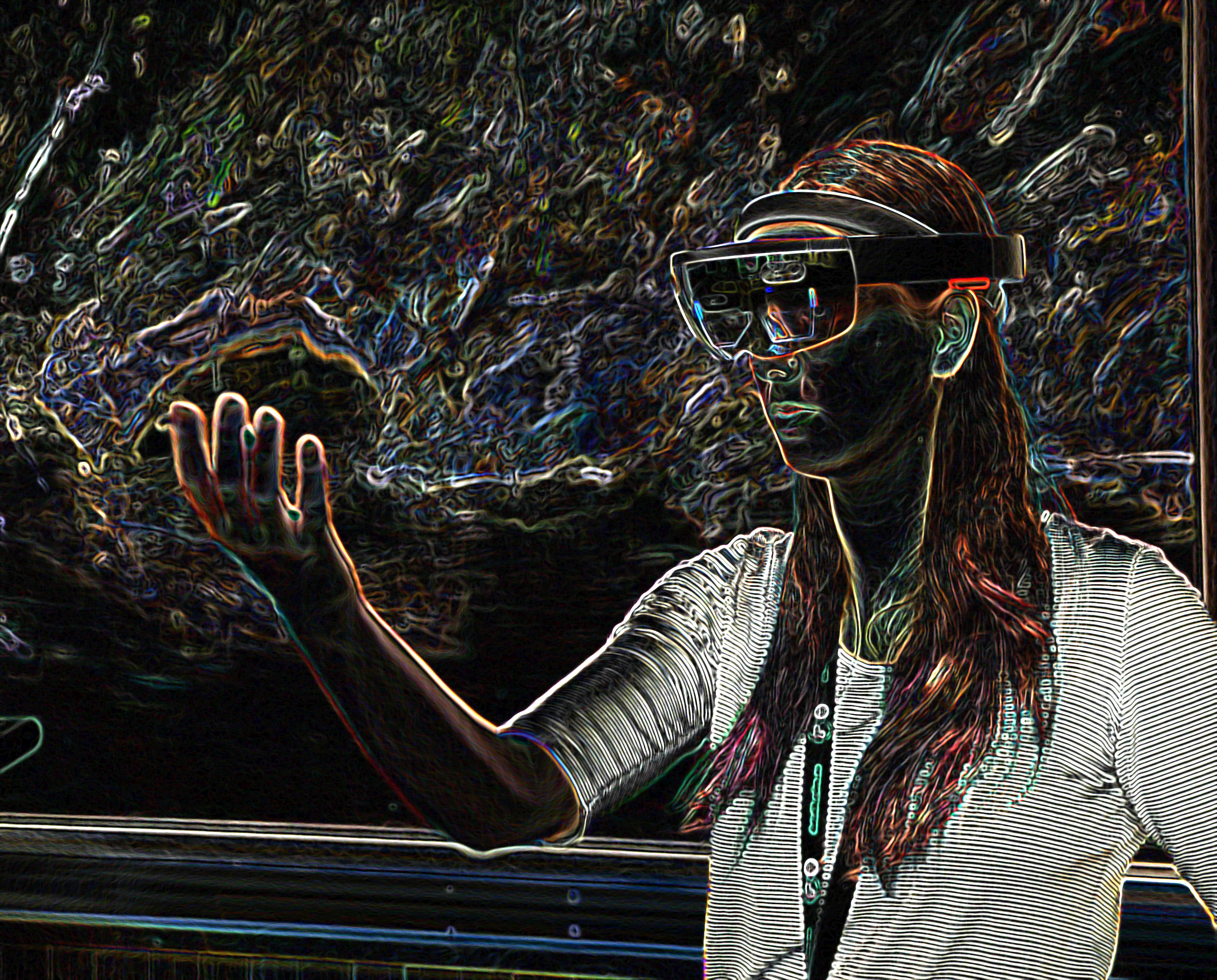 A woman with a VR headset and her hand in front