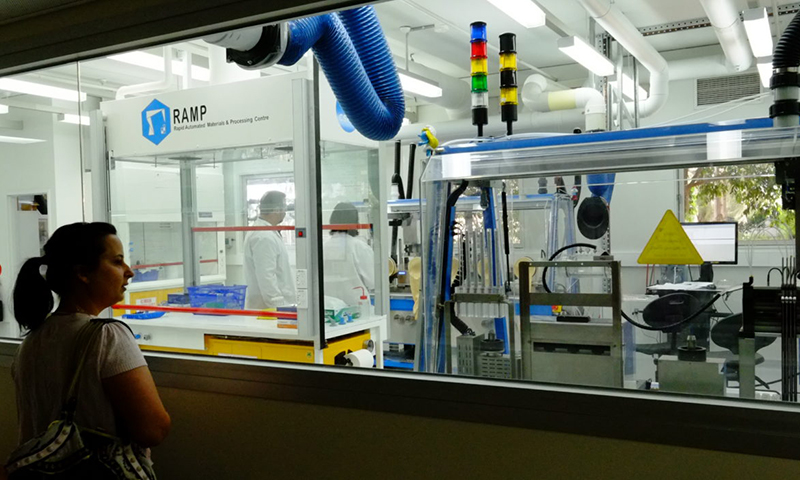 A woman looks into the RAMP lab.