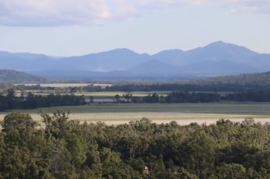 Farmland with a mountain range in the background