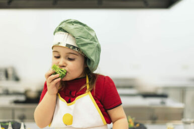 Child eating vegetable